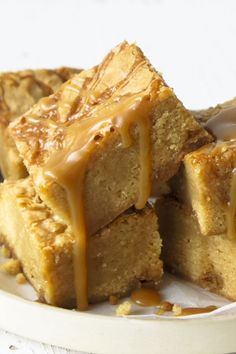 several pieces of cake on a plate with caramel drizzle