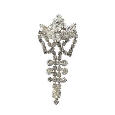 Exceptional large Vintage Clear Rhinestone Crystal  Brooch Pin Costume Jewelry Silver Toned, featuring exquisite glass crystals that add a touch of refinement, in excellent condition. Perfect for adding a touch of sophistication to any outfit, measuring 3.5" h by 1.5" w by 0.25" d. Crystal Brooch, Rhinestone Brooches, Jewelry Silver, Clear Rhinestones, Crystal Glass, Crystal Rhinestone, Costume Jewelry, Brooch Pin, Silver Tone