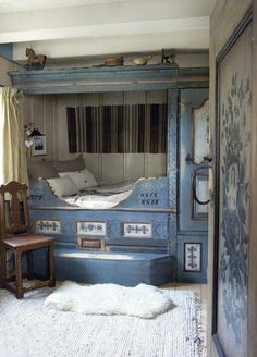 an instagram photo of a bedroom with blue painted furniture and curtains on the walls