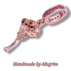 This is a hand painted Pandora sized charm made of 925 rose gold and lab created crystal. The charm is in the shape of a rose with pink crystal along the petals and has a triple charm dangle . The charm is perfect for occasions like engagement, Mother's Day, Christmas, graduation, anniversary, birthday, christening, and Valentine's Day. The charm is themed around nature, gardening, flowers, animals & insects, love, and roses. Adjustable Rose Gold Bracelet With Flower Charm, Elegant Rose Jewelry With Flower Charm, Rose Gold Charms For Valentine's Day, Rose-colored Flower Charm Jewelry For Anniversary, Rose Flower Charm Pendant Jewelry, Triple Charm, Sparkling Rose, Dangle Bracelet, Rose Gold Flower