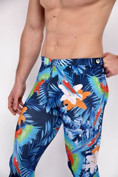 Description: Blue Jungle Print Men's Leggings Breathable & Moisture Wicking 4-Way Stretch Fabric Machine Wash Cold, Quick Drying High Stretch Nylon / Spandex Bolt Logo Patch This design does not have pockets Model is 6’2’’ (189cm) tall, 34’’ (86cm) waist and wears size Large. Stretch Blue Pants With Built-in Shorts, Blue Stretch Swim Trunks For Sports, Blue Moisture-wicking Activewear For Surfing, Moisture-wicking Blue Activewear For Surfing, Stretch Blue Bottoms For Surfing, Blue Stretch Swim Trunks In Athleisure Style, Blue Stretch Athleisure Swim Trunks, Blue Compression Bottoms For Swimming, Bolt Logo