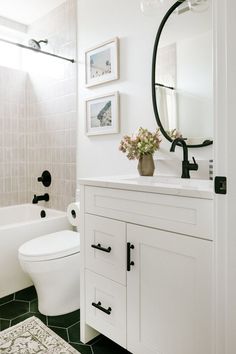 a bathroom with a sink, toilet and bathtub