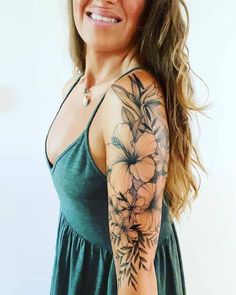 a woman with a flower tattoo on her arm