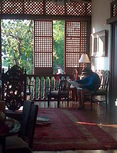 a living room filled with furniture and lots of windows