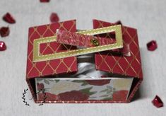 an open red box with gold trim on it