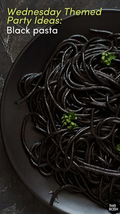 black pasta on a plate with the words, wednesday themed party ideas black pasta written in green