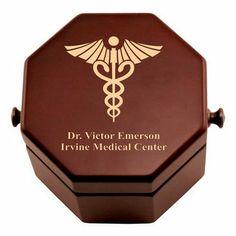 a wooden box with a medical symbol on it