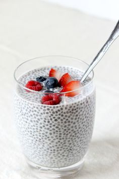 a bowl of chia pudding with berries and blueberries in it on pinterest