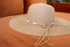 Block the rays in the most stylish of ways! Our BOHEMIAN hat comes in a natural tan woven texture. A straw beaded band tops off the look. Decorate your Summer outfits with a lightweight touch! Measurements: 4” Brim, 3.5” Crown Depth, 7.5” Head Diameter Material: 100% paper Beachy Beige Straw Hat One Size, Casual Beaded Hats For Spring, Beige Beachy Straw Hat, Adjustable Beige Straw Hat For Beach, Casual Beaded Fedora Sun Hat, Beaded Wide Brim Straw Hat For Spring, Casual Beaded Hats For Beach Season, Spring Beaded Wide Brim Straw Hat, Casual Beaded Sun Hat For Summer