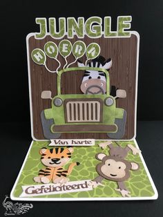 a card with an animal, zebra and monkey in the back of a green truck