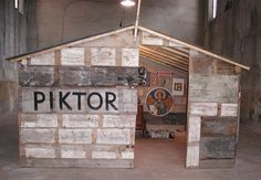 a wooden structure with the word piktor painted on it