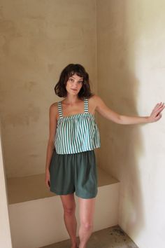 The Sabina Top is a boxy cropped tank created from our custom woven cool-to-the-touch cotton poplin, inspired by classic vintage shirting. The Sabina boasts an effortless and easy cropped fit perfect for pairing with high-waisted trousers and shorts. Worn alongside our newly released Lena Pants in Striped Poplin or the Chloe Shorts- the Sabina is sure to become your next go-to piece for year-round wear! Made in USA Green Relaxed Fit Cotton Crop Top, Summer Cropped Crop Top For Daywear, Cotton Cropped Top For Day Out, Cotton Crop Top For Day Out With Cropped Hem, Summer Cropped Crop Top Relaxed Fit, Chic Boxy Fit Tops For Summer, Chic Boxy Fit Summer Tops, Green Cotton Crop Top For Everyday Wear, Everyday Green Cotton Crop Top