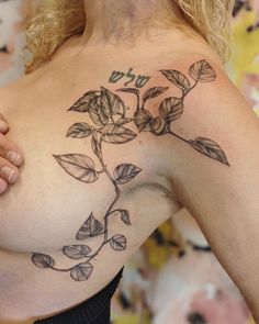 a woman with a tattoo on her chest