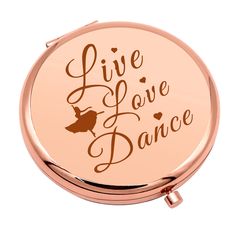 a rose gold compact case with the words live love dance in brown lettering on it