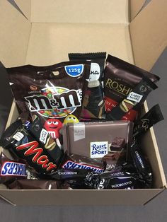 a box filled with assorted chocolates and candy