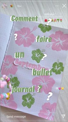 an open notebook with flowers on it and the word september written in cursive writing