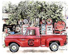 an old red truck parked in front of a gas station