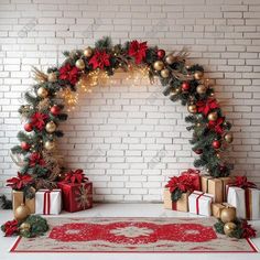 an arch decorated with christmas decorations and presents in front of a white brick wall background