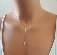 "Sterling Silver Lariat, Tear Drop Lariat, Silver Lariat, Dainty Lariat, Bridesmaid Gift This simple, sweet, every day lariat is right on trend. It would be great for a gift for any woman, for your bridesmaids, or a treat for yourself!  ★DIMENSIONS + INFO ▾ ~ Necklace length (not including drop): 14-20 inches. ~ Charm: 3 D tear drop (10 mm) ~ Drop is 3 inches long. If you want a longer drop, leave a personalization note. ~ Materials: 14k gold filled, sterling silver, silver plated, 18k gold plat Dainty Adjustable Lariat Necklace For Party, Adjustable Y-shape Drop Necklace As Gift, Adjustable Y-shape Drop Necklace For Gift, Adjustable Y-shape Drop Necklace Gift, Adjustable Silver Backdrop Necklace For Gift, Delicate Adjustable Drop Necklace For Party, Adjustable Y-shape Lariat Necklace For Gift, Adjustable White Backdrop Necklace For Gift, Delicate Adjustable Silver Lariat Necklace