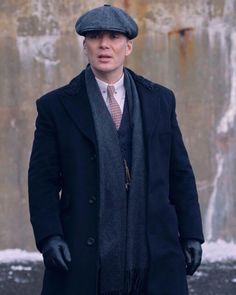 Peaky Blinders Thomas Shelby Blue Coat With Fur Collar Introducing Tommy Shelby navy blue long coat for all our Peaky Blinders fans and fashion enthusiasts wishing to channel his iconic and distinctive sense of style. A nod to 19th-century style, this trench coat is the epitome of sophistication and classic elegance. Constructed using premium wool, it gives the wearer unparalleled warmth and comfort while ensuring durability and a luxurious experience. The interior is crafted from soft viscose, which further adds to the functionality and commitment to the best quality for our customers. The blue hue of the wool provides a cool and calming look, just like that of Tommy's personality. Featuring a tailored design, the coat’s silhouette enhances the wearer's structure, offering a flattering fi Classic Fitted Blue Pea Coat, Classic Blue Long Pea Coat, Fitted Classic Blue Pea Coat, Classic Blue Long Peacoat, Blue Business Pea Coat For Winter, Blue Notch Lapel Peacoat For Winter, Navy Notch Lapel Pea Coat For Winter, Classic Blue Peacoat With Lapel Collar For Winter, Blue Peacoat With Lapel Collar For Winter