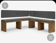 the bench is made out of wood and grey fabric