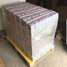 stacks of money sitting on top of a pallet