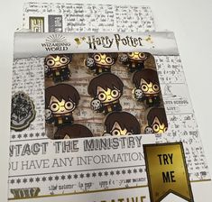 some harry potter badges are in a box