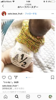 the baby is wearing a diaper with numbers on it