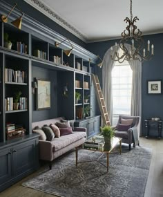 a living room with bookshelves, couches and a ladder in the corner