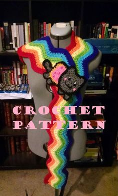 a crochet rainbow scarf with a teddy bear on it and the words crochet pattern