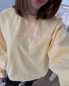 Sweatshirt embroidered with "out of office" -Model is wearing size L, Pale Yellow sweatshirt color, and Blush thread color -Sweatshirts are unisex fit, sizes available are: S, M, L, XL, 2XL, and 3XL -Sweatshirt colors: Black, White, Sand, and Ash Grey -Premium sweatshirt colors: Vintage Black, White, Baby Blue, Lilac, Pale Yellow, Vintage Cement, Vintage Cocoa, Vintage Soft Pink, and Vintage Pine -Thread colors: Black, Grey, Cream, White, Brown, Tan, Red, Orange, Yellow, Forest, Avocado, Teal, N Cotton Sweatshirt With Embroidered Text, Relaxed Fit, Relaxed Fit Cotton Sweatshirt With Embroidered Text, Cotton Loungewear Sweater With Embroidered Text, Oversized Casual Sweatshirt With Embroidered Text, Everyday Cotton Sweatshirt With Letter Embroidery, Cotton Long Sleeve Sweatshirt With Letter Embroidery, Casual Cotton Sweatshirt With Embroidered Text, Long Sleeve Sweater With Embroidered Text For Loungewear, Casual Everyday Sweatshirt With Letter Embroidery