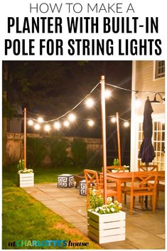 an outdoor patio with string lights and potted plants on the ground, in front of a