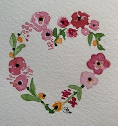 a heart made out of flowers painted on paper