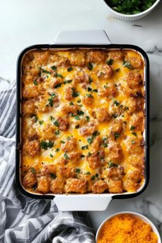 a casserole dish with meat and cheese in it on a marble countertop