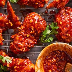 chicken wings covered in bbq sauce and garnished with cilantro