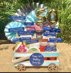 a wooden wagon filled with lots of items