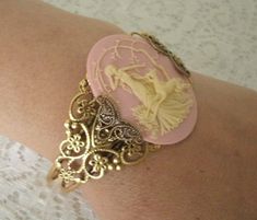 This beautiful antique brass filigree cuff bracelet has antique brass filigree accents and a beautiful goddess Diana cameo. Adjustable. Victorian Bangle As Gift, Handmade Victorian Brass Bracelets, Bohemian Nickel-free Cuff Bracelet For Wedding, Nickel-free Bohemian Cuff Bracelet For Wedding, Bohemian Brass Cuff Bracelet For Wedding, Antique Brass Bangle For Gifts, Victorian Brass Wedding Bracelets, Victorian Adjustable Bangle - Gift, Victorian Adjustable Bangle As A Gift