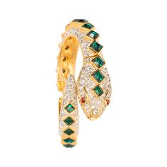 a gold and green ring with diamonds on the inside, set in 18k yellow gold