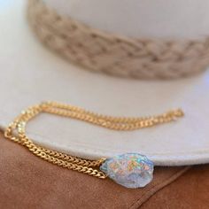 Angel aura quartz is a magical stone bringing you joy and optimism. This unicorn crystal is a high vibrational stone you want to take with you everywhere you go! Wear it, hold it, meditate with it and put it on your heart as you affirm your gratitude each day. Angel aura quartz crystal, approx 15mm x 20mm Gold plated curb chain 4mmx5mm Handmade in Arizona Necklace size guide Size 14" will typically be a choker style. Please use the size guide to confirm your length. Because all crystals & gemsto Obsidian Necklace, Aura Quartz Crystal, Magical Stones, Carnelian Necklace, High Vibrational, Angel Aura Quartz, Angel Aura, Meaningful Jewelry, The Lighthouse