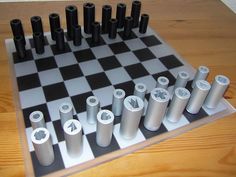 a chess board with black and white pieces on it