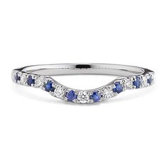 a white gold wedding band with blue and white stones on the side, set in 18k white gold