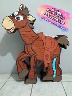 a cardboard horse that is on the ground