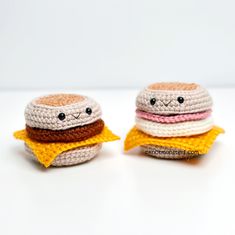 two small crocheted hamburgers sitting on top of each other