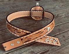 a brown leather belt with white stitching on it