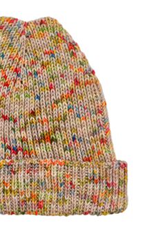 a multicolored knitted hat on a white background