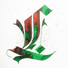 an arabic calligraphy in green, red and black ink on white paper with watercolor stains