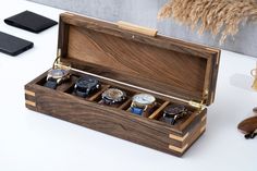 Meet this stylish watch box, carefully handcrafted from first-class solid walnut wood. With its classic design, the five-slot watch box for men allows you to display your watch collection aesthetically while keeping it organized and safe.  This watch case, every detail of which has been meticulously considered, reveals the unique texture and beauty of natural walnut wood. In the mens watch box, dovetail joints made of ash wood add stability to the corners, while the dovetail-style handle provide Personalized Watch Box, Luxury Watch Box, Watch Box For Men, Wood Watch Box, Personalized Watch, Wooden Watch Box, Wood Hinges, Watch Display Case, Mens Watch Box