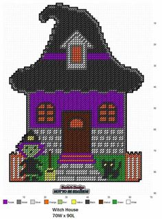 a cross stitch house with a cat and pumpkin on the front, it is purple