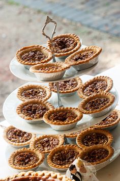 there are many pies that are on the cake plate and it is ready to be eaten