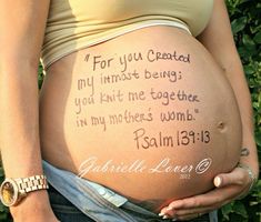 a pregnant woman holding her belly with the words for you created